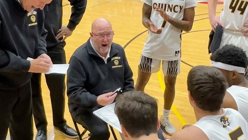 Quincy University Coach Steve Hawkins talks to his team during the Hawks' 88-51 victory over...