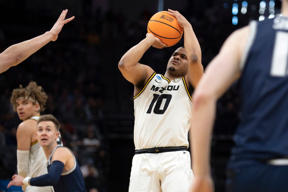 Missouri guard Nick Honor (10) shoots during the first half of a first-round college...