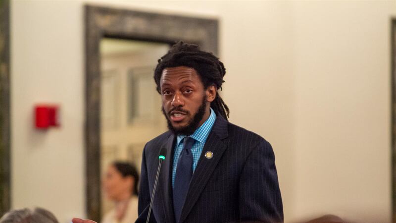 State Sen. Mike Simmons, D-Chicago, speaks on the floor of the state Senate. He passed a...