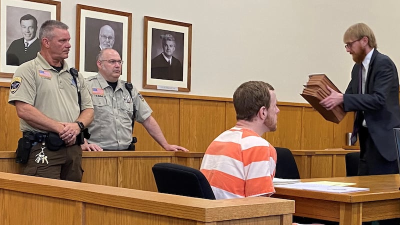 Assistant Public Defender John Citro, right, leaves the courtroom after being excused from the...
